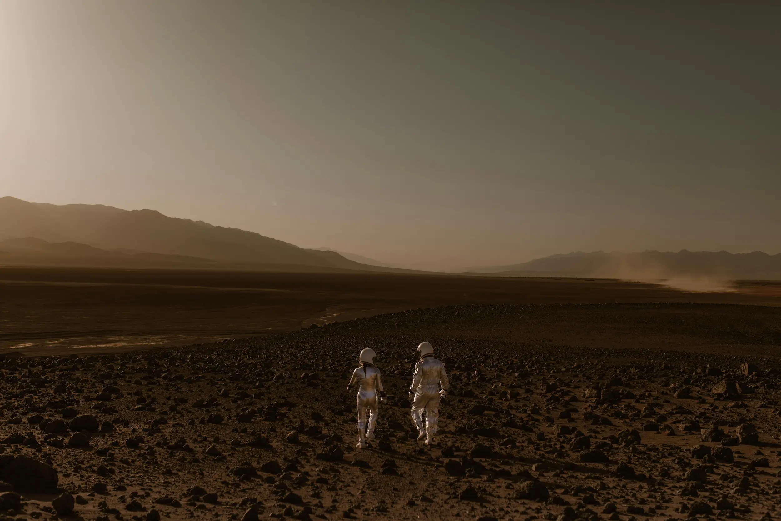 Desert landscape with two people walking