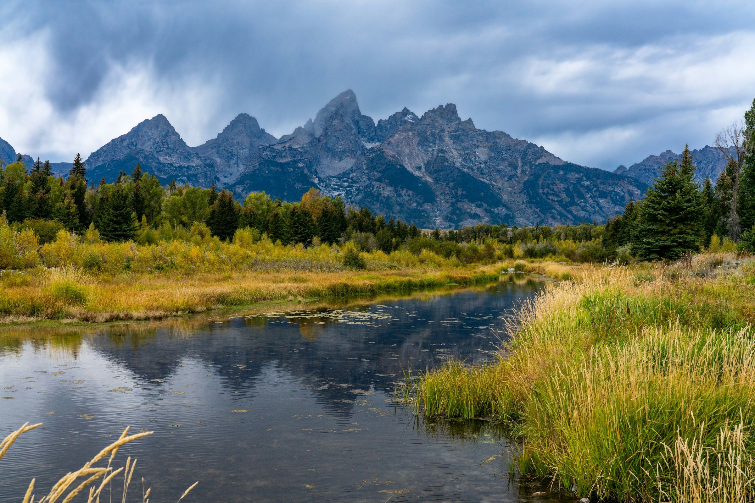 Grand Teton mountains reflected in alpine lake