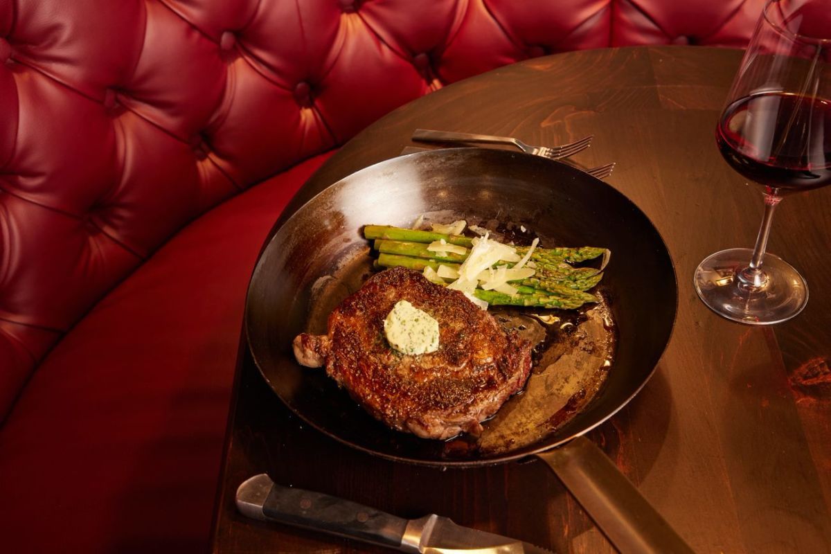 Plated steak with asparagus and red wine at upscale Jackson Hole restaurant