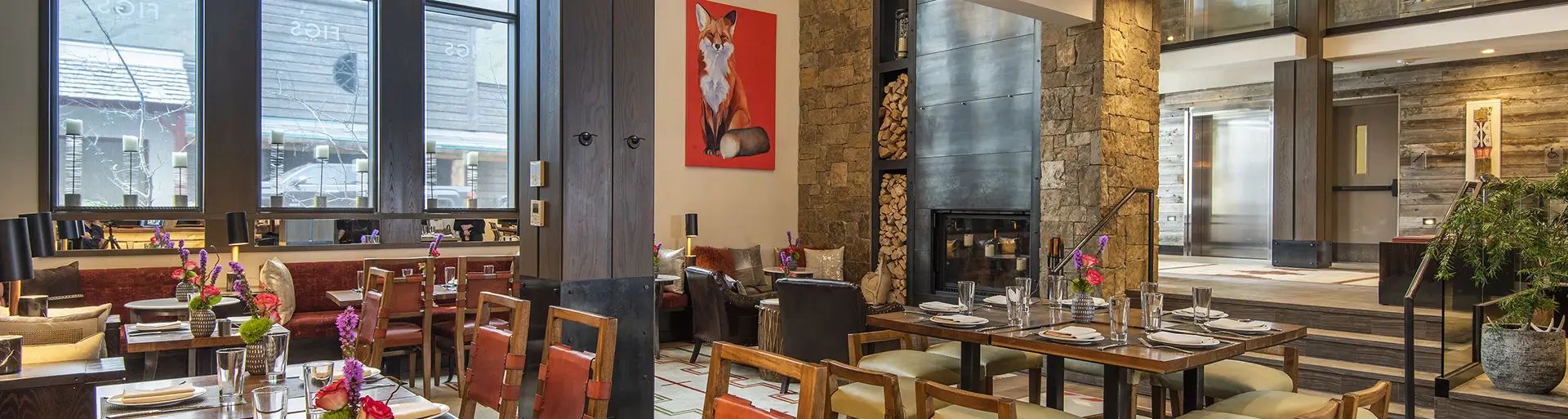 Hotel Jackson restaurant interior with brick pillars, large windows and contemporary western decor
