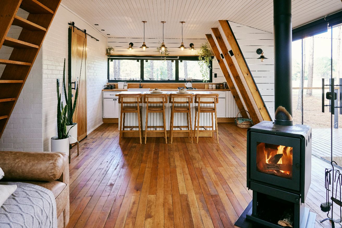 Modern rustic kitchen and living area inside STR property