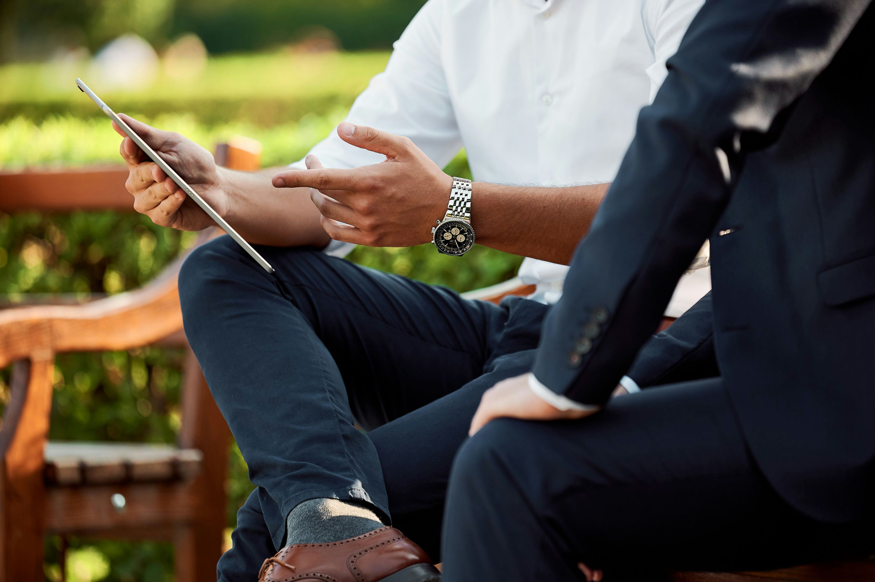 Real estate agent reviewing STR investment analysis with client on tablet