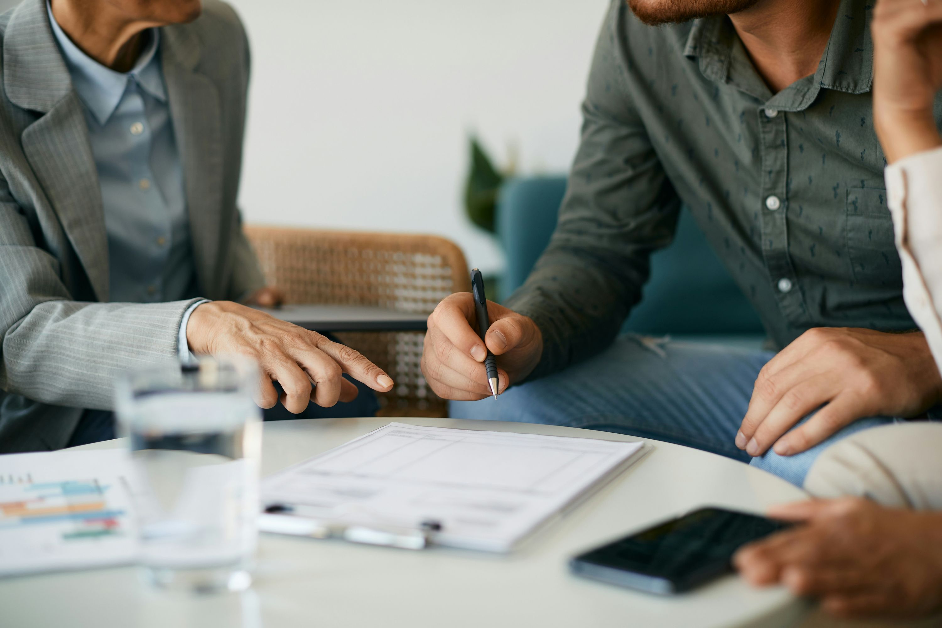 Real estate professionals reviewing short-term rental pro forma documents