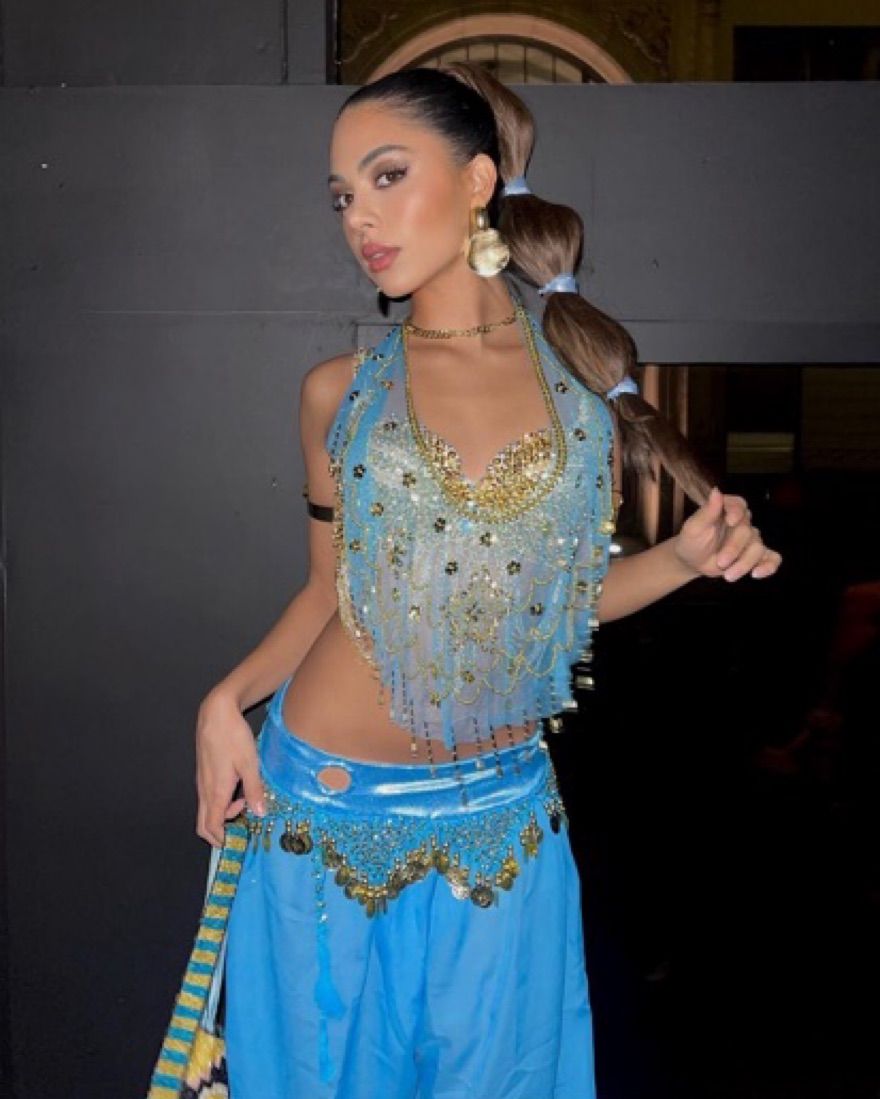 Jasmine costume with a turquoise beaded top and blue pants