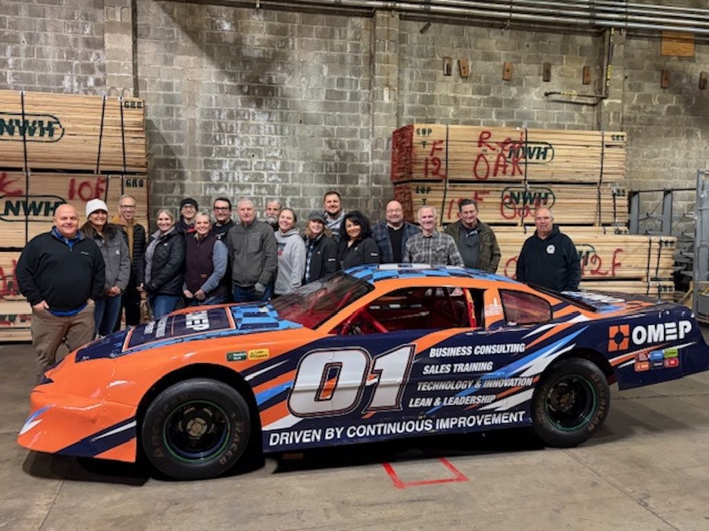 Team photo with the OMEP Pit Crew Race Car