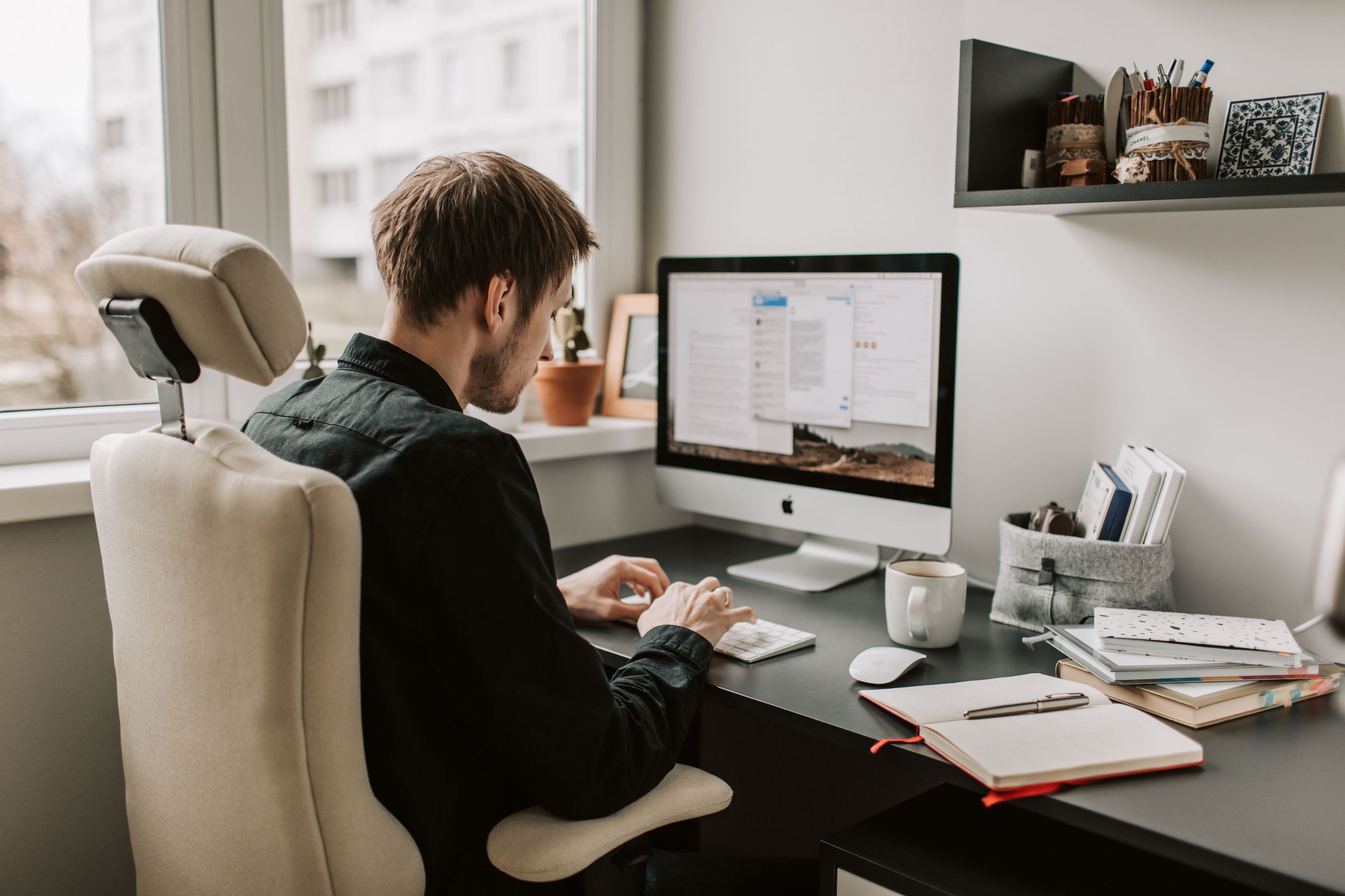Marketing professional working at a home office desk