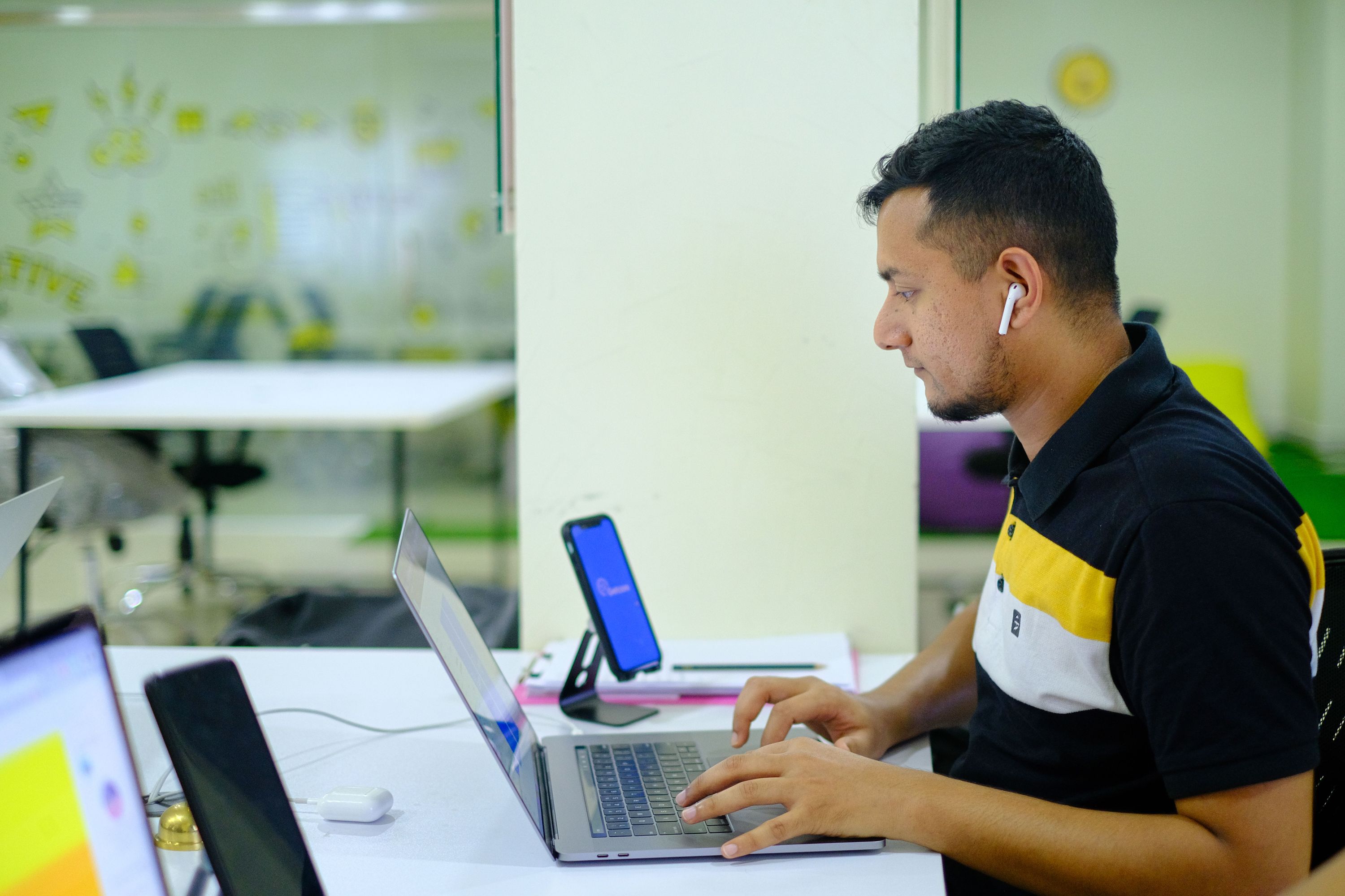 Professional working on a laptop in a modern office