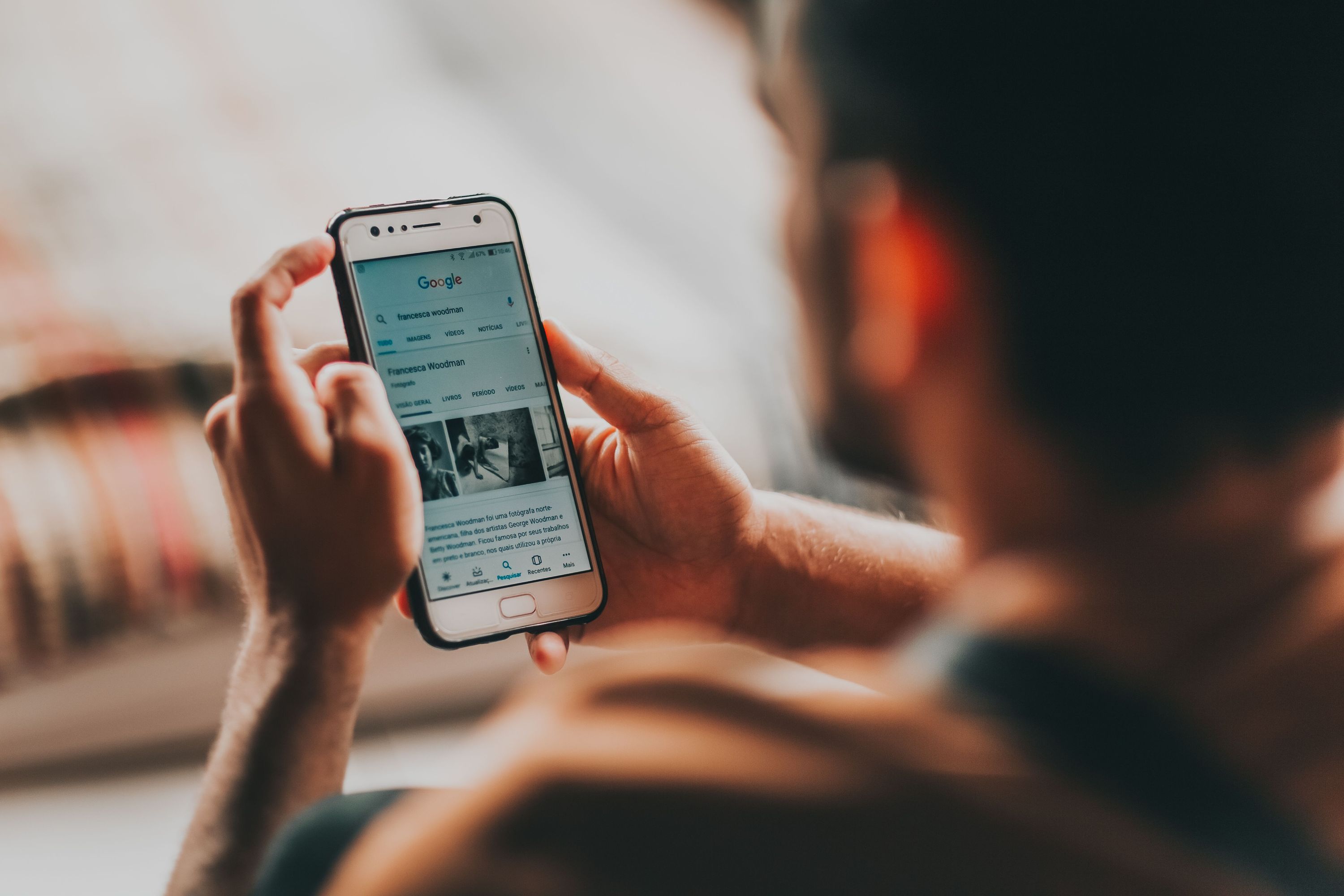 Person viewing Google search results on a smartphone
