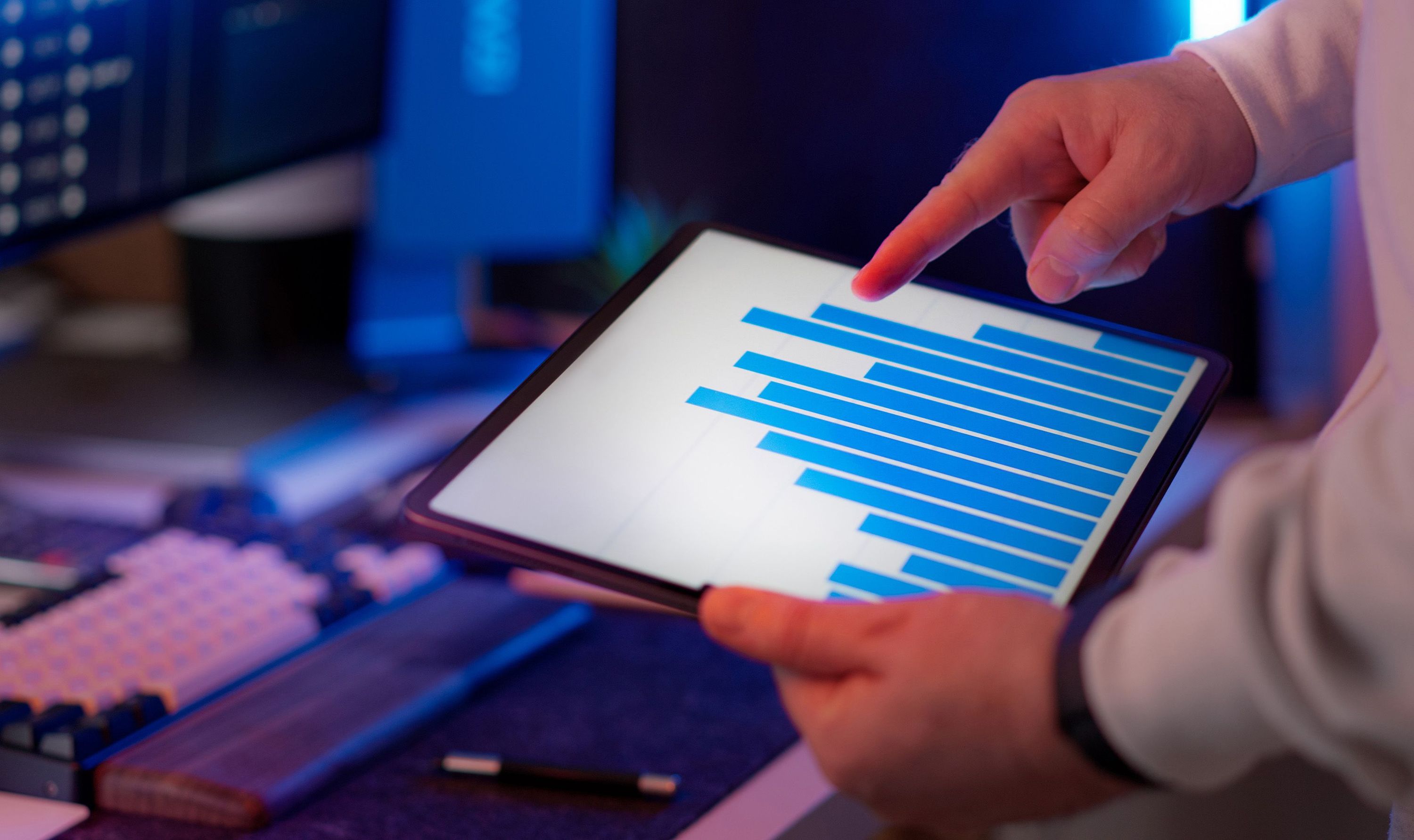 Professional reviewing conversion analytics on a tablet