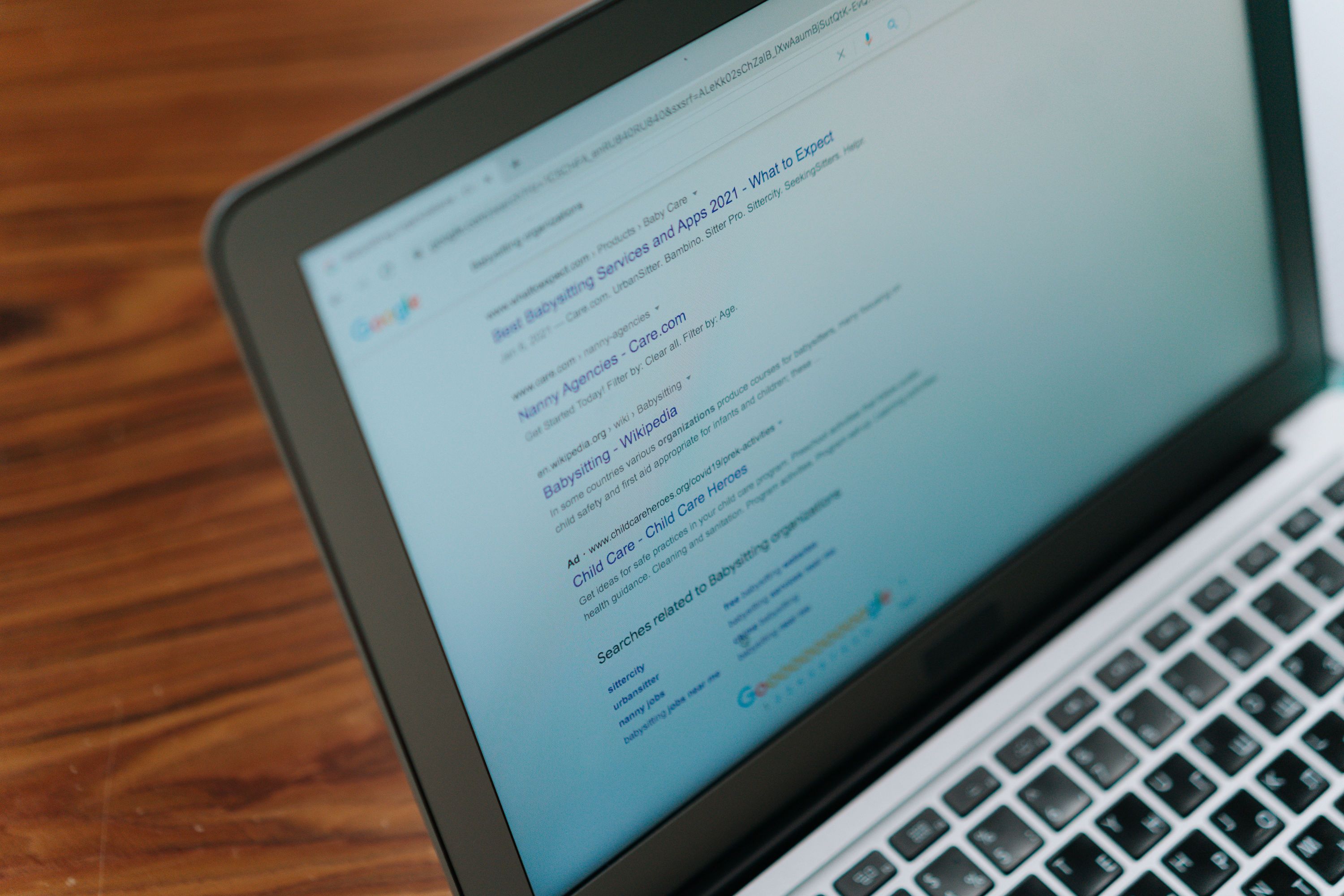 Laptop displaying search results for Google Ads optimization