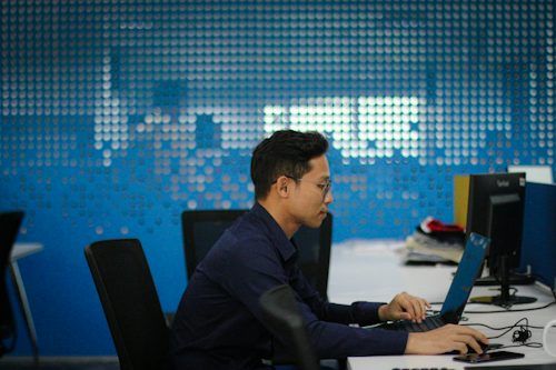 Man working at a computer in a modern office
