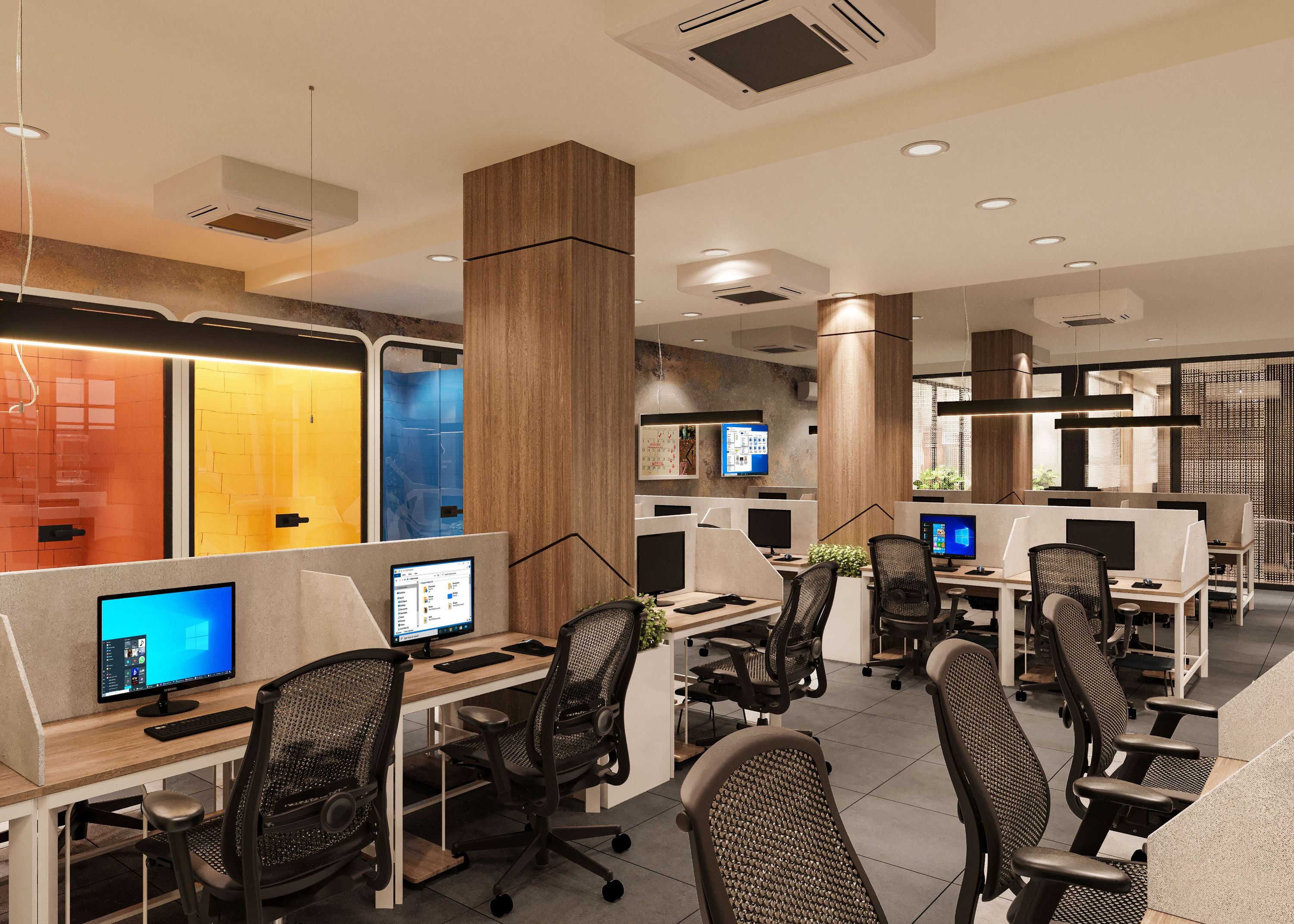 Open-plan office with computer workstations, wood columns, and colorful glass partitions
